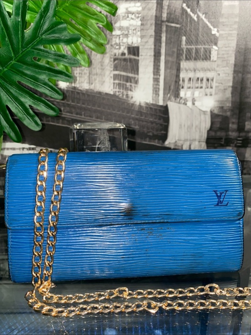Authentic Louis Vuitton Blue Epi Sarah Wallet with flap closure